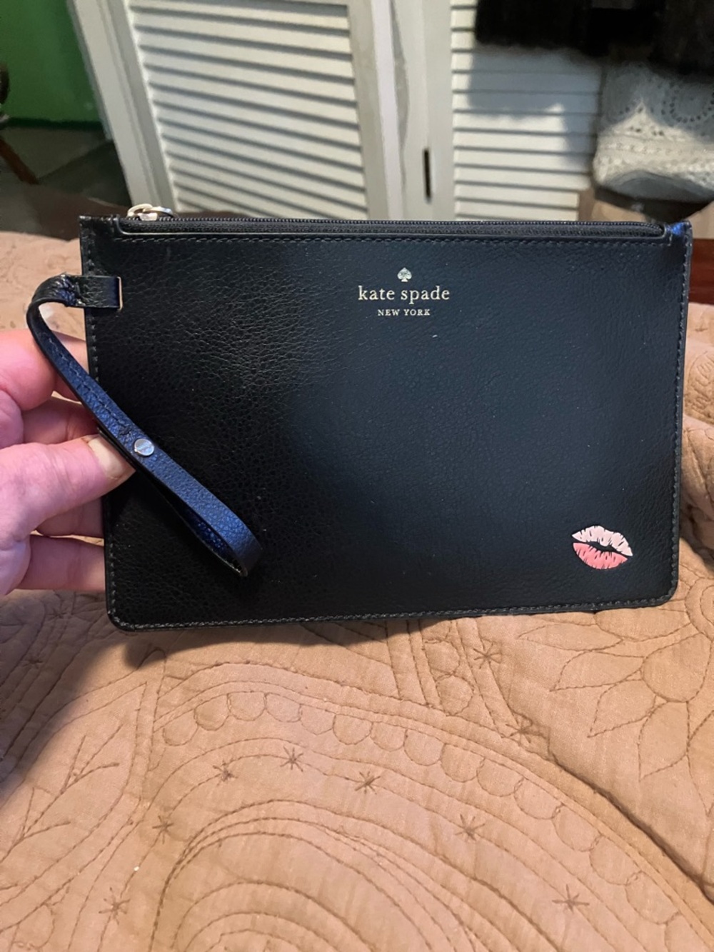 kate spade black wristlet clutch with pink kiss decal